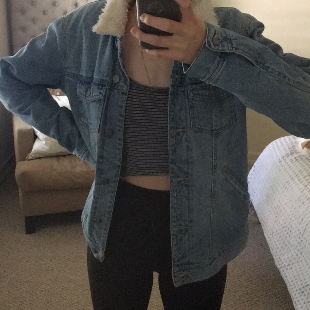Never worn jean jacket with fur interior